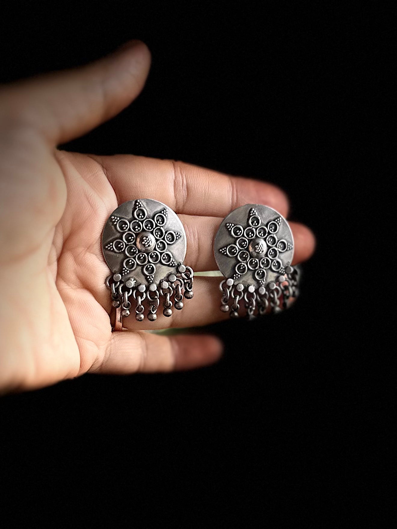 NYASAA . Elegant silver studs with ghungroos .