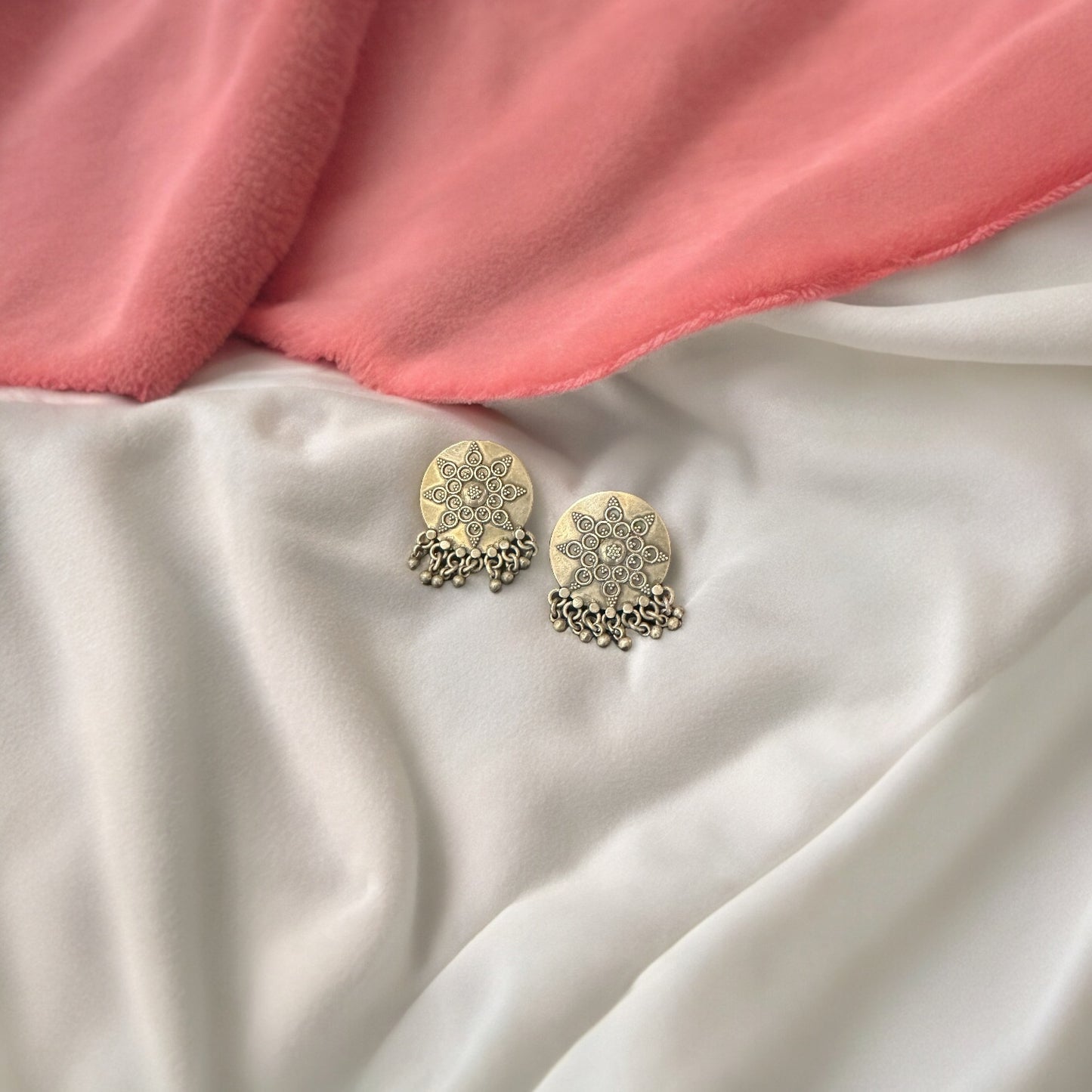 NYASAA . Elegant silver studs with ghungroos .