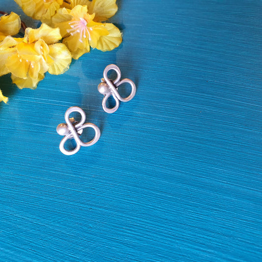 SHOBHINI. The tri petalled studs  .