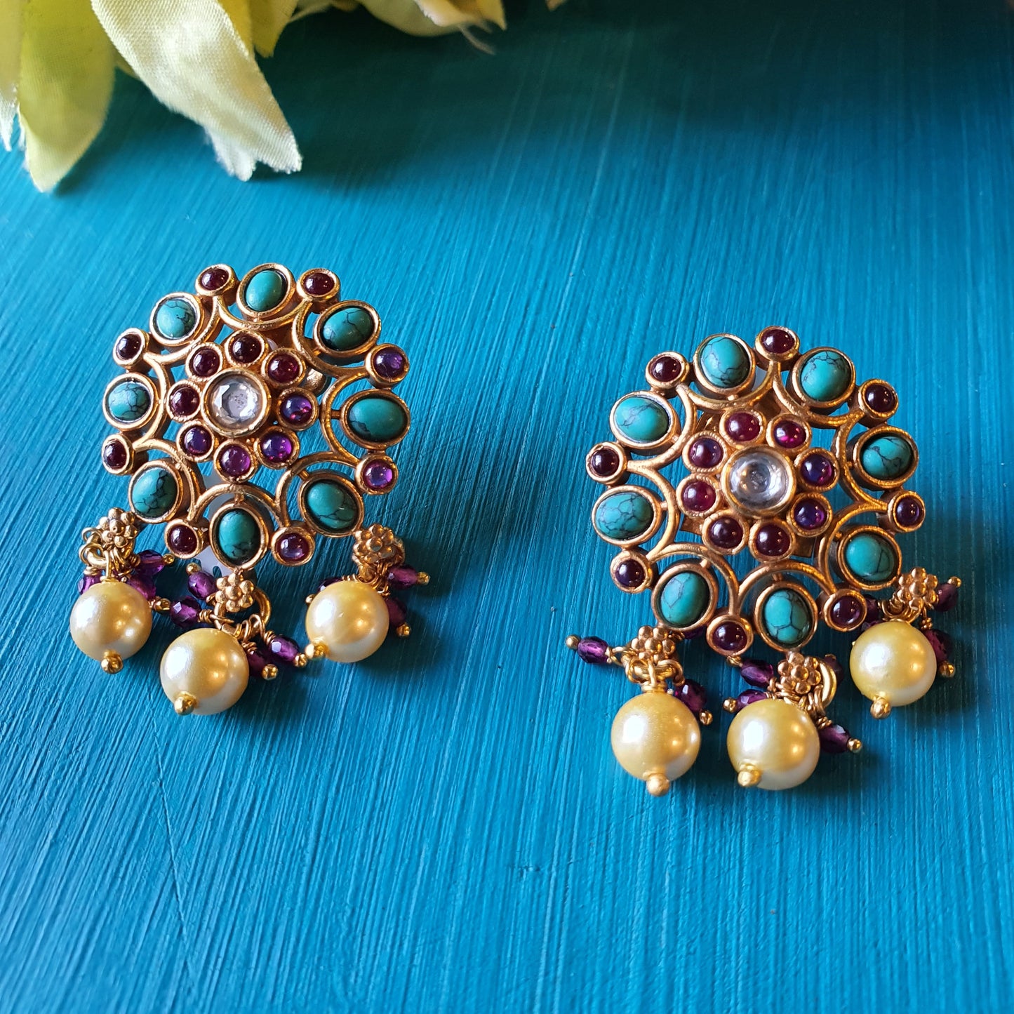 NEELADRI. The gold plated , temple studs.