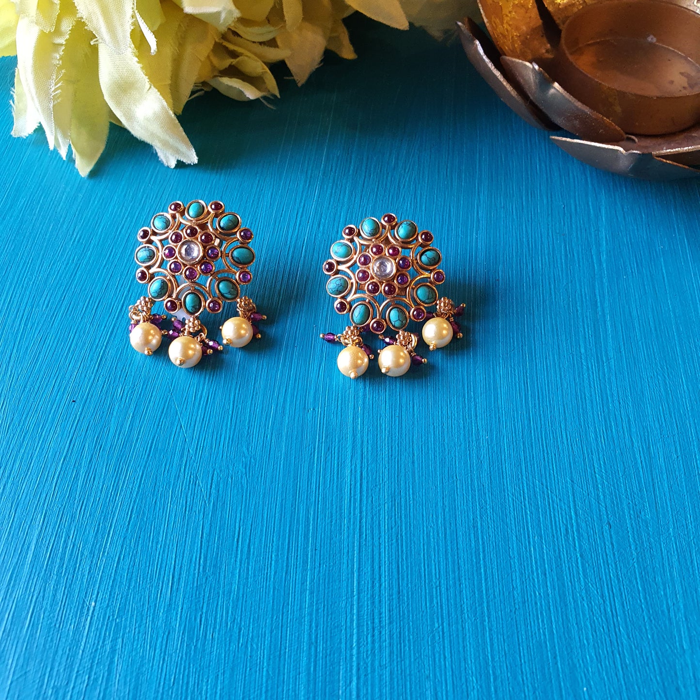 NEELADRI. The gold plated , temple studs.