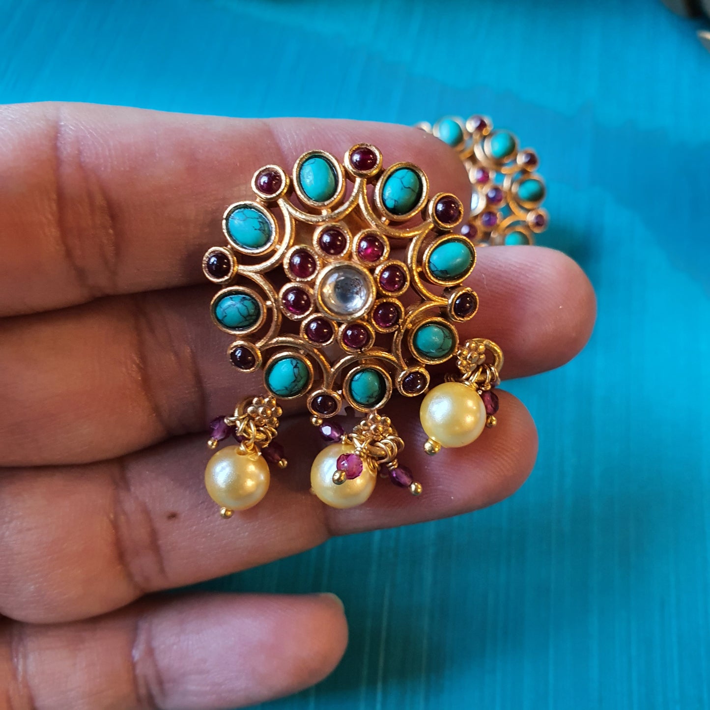 NEELADRI. The gold plated , temple studs.